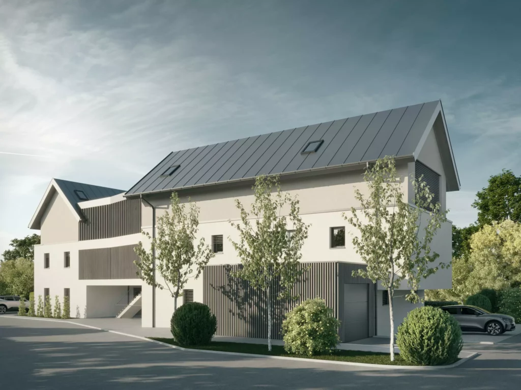 deutinger-projektentwicklung-baumanagement-generalunternehmen-immobilien-salzburg-projekt-wohn-traum bluntaustrasse-golling-03-neu Modernes Wohngebäude mit grauem Steildach, weißen Fassaden und begrünten Außenanlagen an ruhiger Straße im Novemberlicht