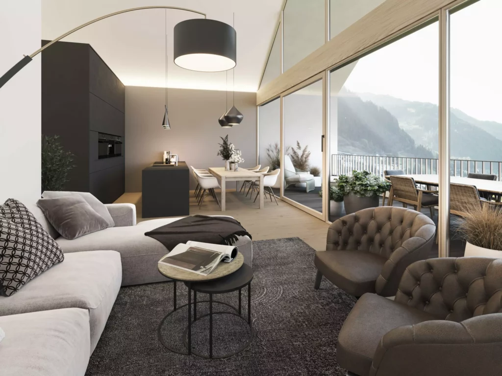 Kamera_TOP11 Moderner Wohnbereich mit Sofa, zwei Sesseln, Esstisch, offener Küche und großer Glasfront mit Bergblick und Balkon im