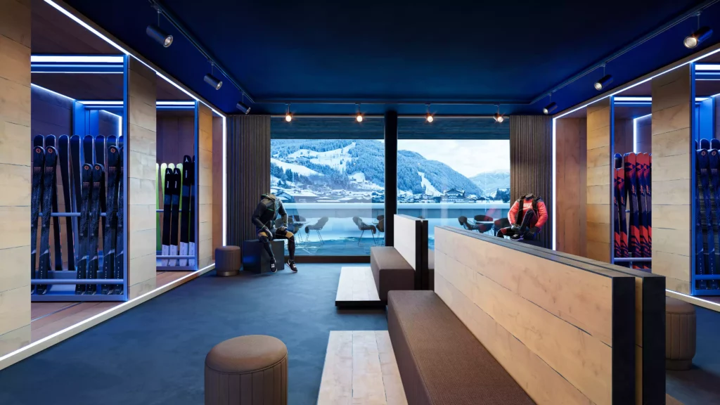 Sport Panorama_Sportraum Moderner Sportraum mit Skiern, Sitzbänken und großer Fensterfront mit Blick auf verschneite Berglandschaft im Hochbauprojekt