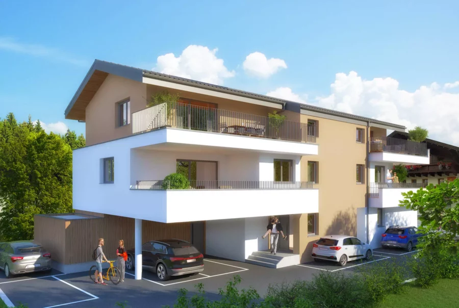 Modernes Wohngebäude mit Balkonen, Parkplätzen und Personen vor grünem Hintergrund bei blauem Himmel in Großarl, Salzburg