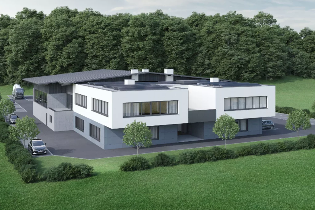 deutinger-projektentwicklung-baumanagement-generalunternehmen-immobilien-salzburg-projekt-buerocenter-meister Modernes Bürogebäude mit weißer Fassade und großen Fenstern, umgeben von Grünflächen und Bäumen, Salzburg Projekt