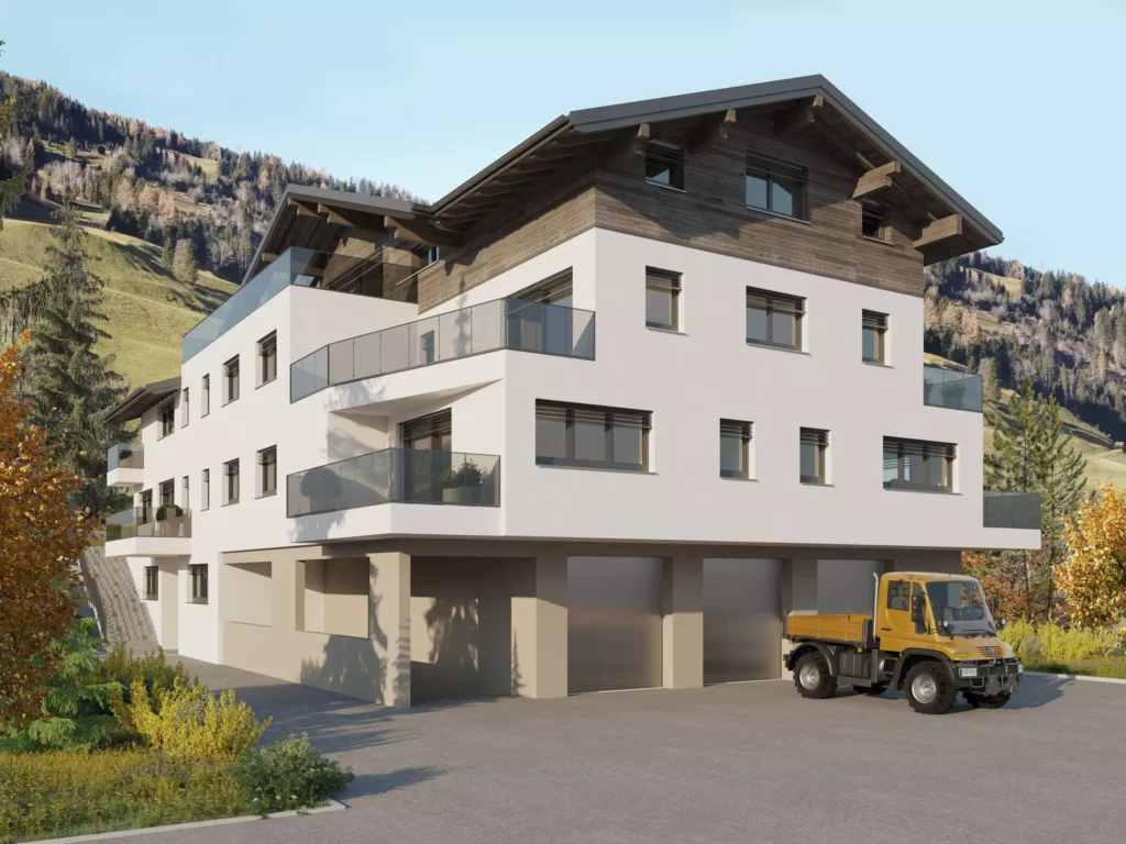 deutinger-projektentwicklung-baumanagement-generalunternehmen-immobilien-salzburg-projekt-mehrzweckhaus-huettschlag-02 Modernes Mehrzweckhaus mit weißen Fassaden, Holzgiebel und Glasbalkonen vor Bergkulisse in Hüttschlag, Salzburg.