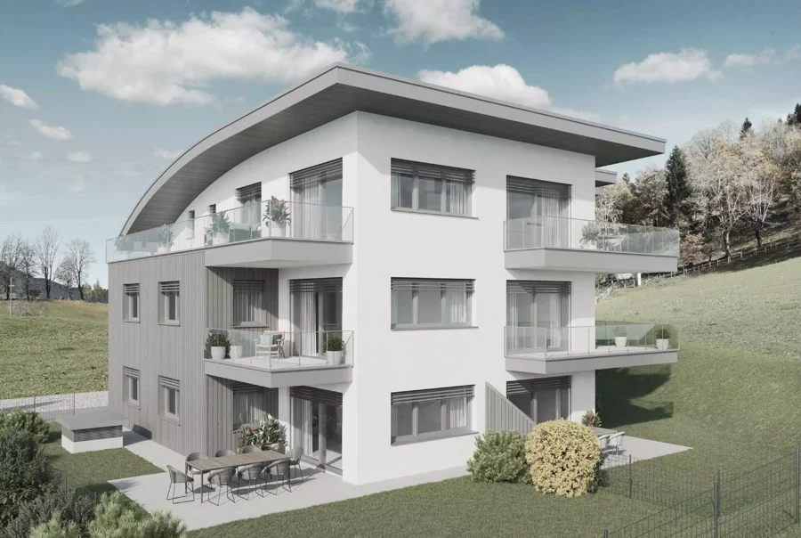 Modernes Wohngebäude mit Balkonen und Terrasse in grüner Hanglage unter blauem Himmel in Salzburg Alpendorf Mountainview