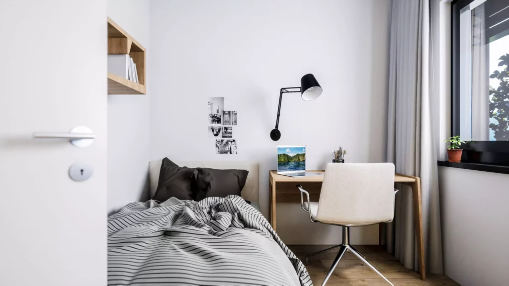 deutinger-projektentwicklung-baumanagement-generalunternehmen-immobilien-salzburg-projekt-mountainview-alpendorf-Kinderzimmer-Top-5 Modern eingerichtetes Kinderzimmer mit Einzelbett, Schreibtisch, Laptop und Fenster mit Vorhängen in Salzburg Mountainview