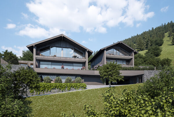 Modernes Chalet mit großen Glasfronten und Terrasse in grüner Berglandschaft bei St. Johann im Pongau