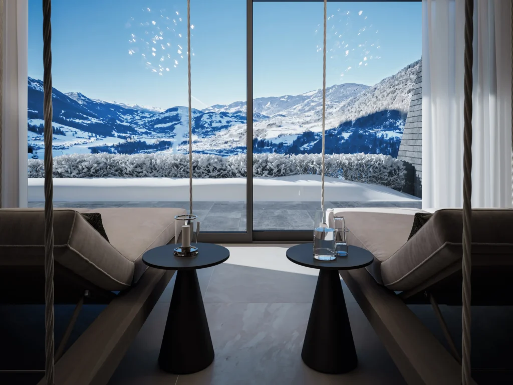 chalet-st-johann-im-pongau-wellnessbereich-mit-aussicht-winterlandschaft Wellnessbereich im Chalet St. Johann im Pongau mit zwei Liegen, Tischen und Blick auf verschneite Winterlandschaft und Berge