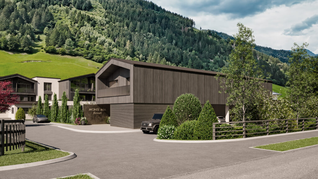 monte-mia-grossarl-ansicht-ost Eingangsbereich des Monte Mia Resorts in Großarl mit moderner Holzarchitektur und begrünter Außenanlage vor Bergkulisse