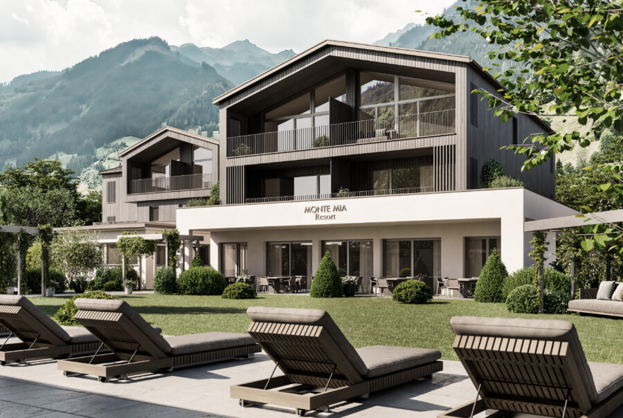 Außenansicht des Monte Mia Resorts in Großarl mit moderner Architektur, Garten, Liegestühlen und Bergkulisse